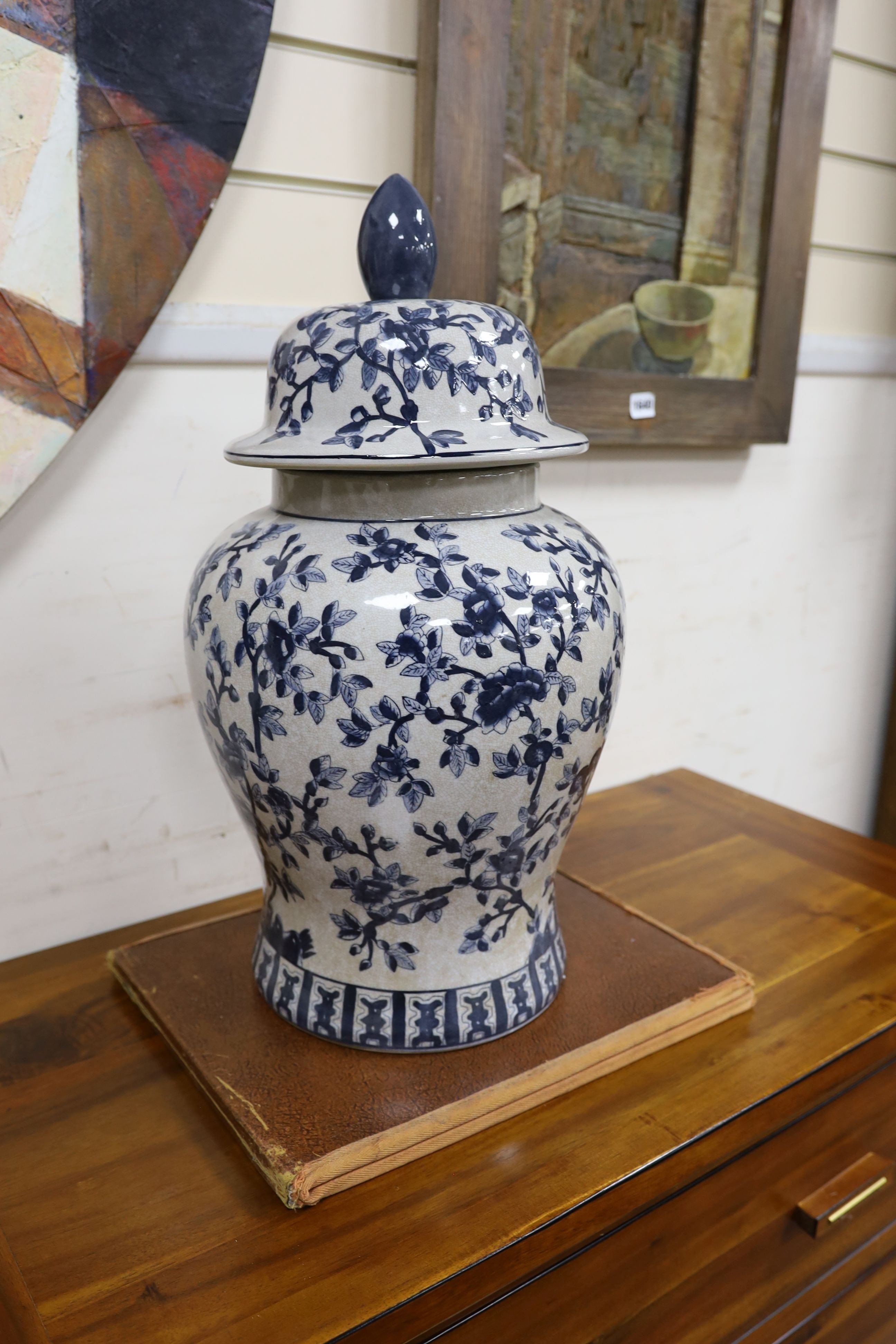 A Chinese style blue and white lidded baluster vase and a cylindrical stick stand (2)